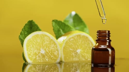 Dripping Lemon Juice From Pipette Into Bottle Closeup Vitamin Oil