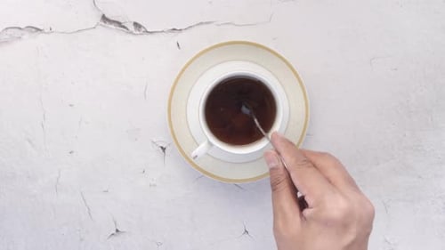Green Tea and Sugar Cube on Table with Copy Space