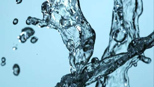 Water pouring and splashing in ultra slow motion 1500fps on a reflective surface - WATER POURS