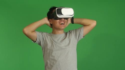 Man Using VR Headset with Green Screen