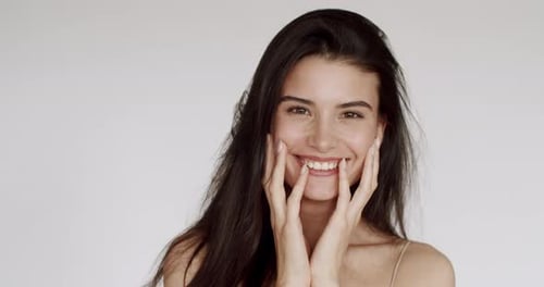 Woman Posing with Hands on Face