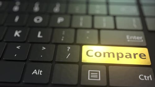 Black Computer Keyboard and Gold Compare Key