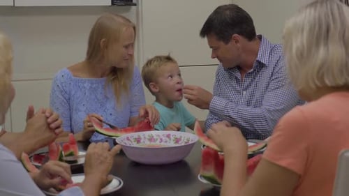 Happy Family Eating Watermelon Together