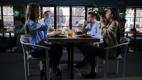 Group of Friends Having Lunch in City Restaurant