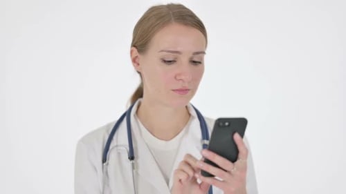 Young Woman Doctor Using Smartphone on White Background