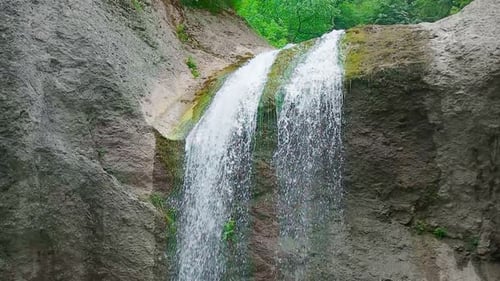 Picturesque Waterfall Cascading Down Mossy Rocks