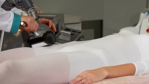 Gorgeous Young Woman Having LPG Massage Session at Cosmetology Clinic