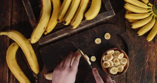 Slicing a Banana on Cutting Board