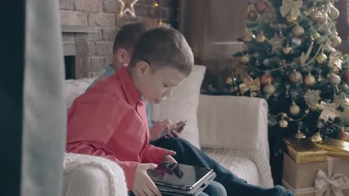 Children with Electronics at Christmas Indoors