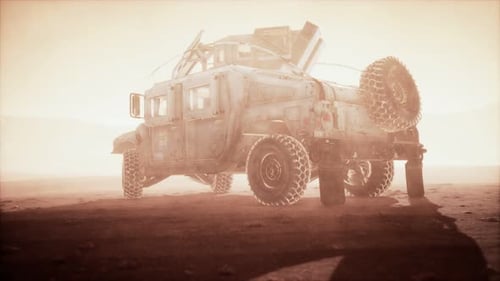 Military Patrol Car on Sunset in Desert Storm