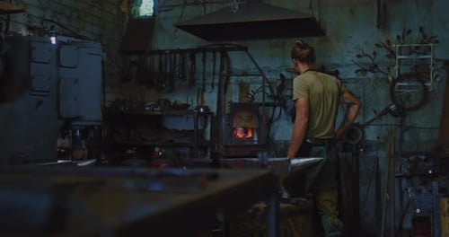 Craftsman Working by a Forge in a Workshop