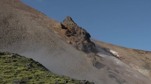 Iceland. Geothermal field with fumaroles and geysers. Natural steam vents. Smoking fumaroles.