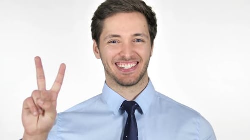 Young Man Makes Peace Sign in Business Attire