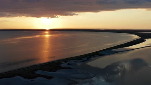 Beautiful sea sunset. Quadcopter flight over the sea at sunset.