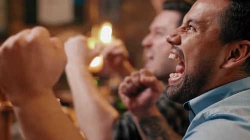 Friends Cheering and Yelling at a Sports Bar
