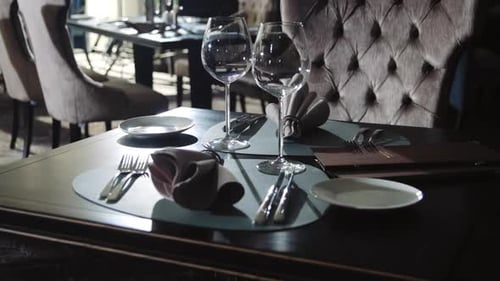 Wine Glass and Plate for Dinner in Restaurant. Tableware Set on Dining Table