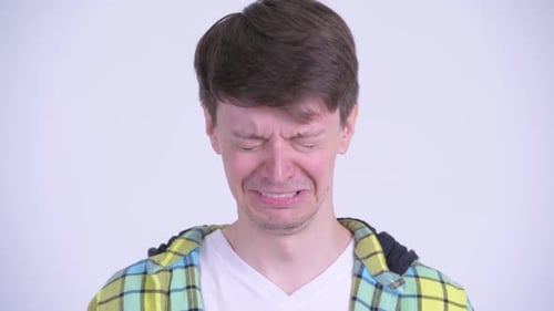 Face of Sad Young Man Crying and Looking Depressed