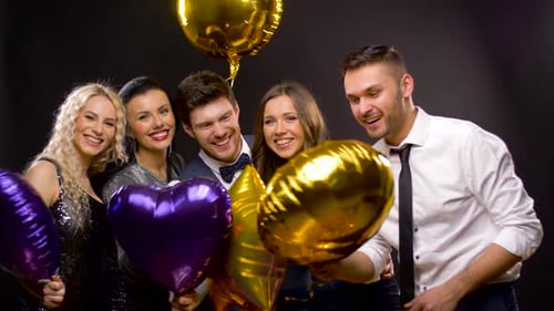 Formally Dressed People with Balloons Celebrate