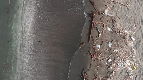 Super Close Up Aerial Pan Along Dirty Beach