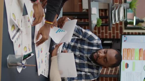 Business Team Analyzes Data Together in Modern Office