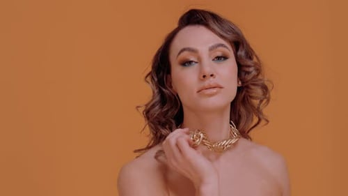 Woman Posing with Gold Necklace