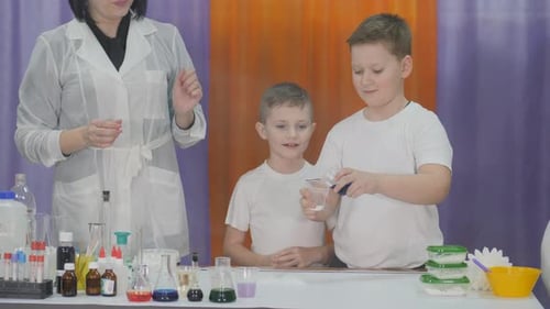 Children Doing Science Experiments With Teacher