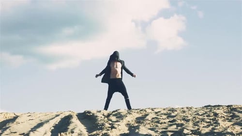 Man in Black Mask in Desert