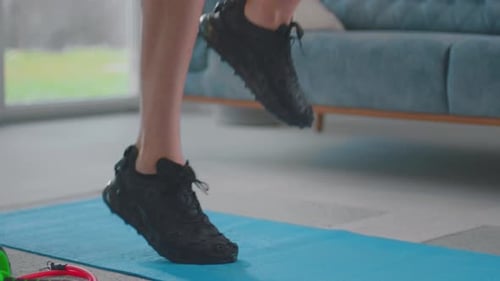 Man jumping on floor mat