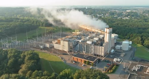 Industrial Thermal Power Station Smoke Stacks with Pollution of Steam