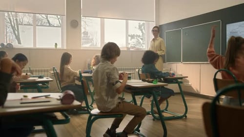 Elementary School Students in Classroom with Teacher