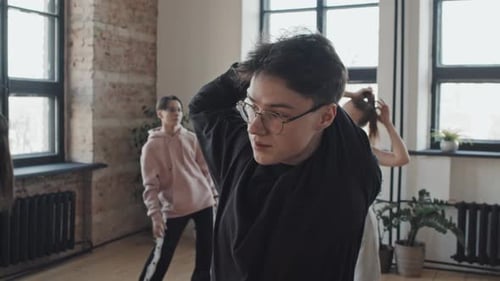 Guy Stretching in Studio