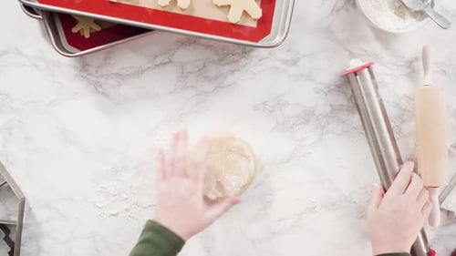 Flat lay. Step by step. Rolling out sugar cookie dough to bake Christmas cookies.