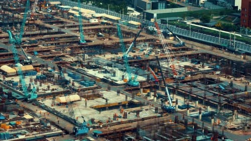 Large Construction Site with Heavy Construction Machinery in Metropolis