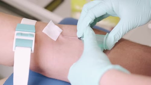 Doctor Makes Blood Sampling for Analysis From the Patient's Vein