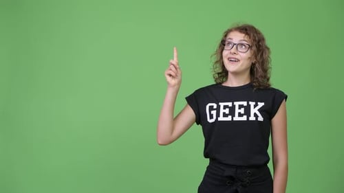 Young Adult Pointing With Geek Shirt On