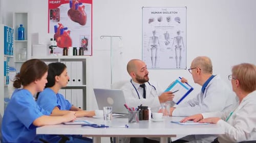 Medical Team Meeting in Modern Hospital Room