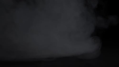 Dramatic Grey Smoke Drifting on Dark Background