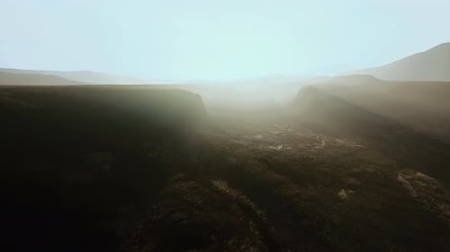 Misty Canyon Aerial Flythrough with Sun Rays
