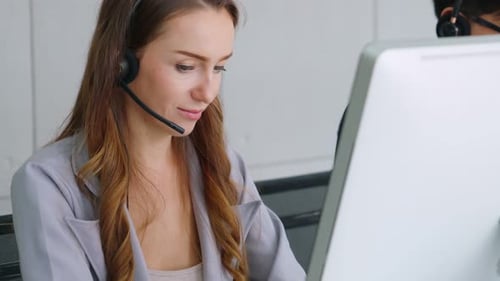 Business People Wearing Headset Working in Office