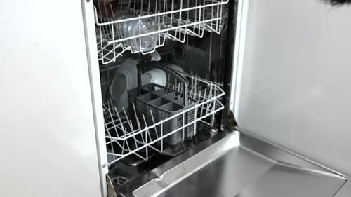 Man Takes Dishes Out of Dishwasher