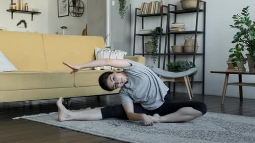 A young girl doing yoga in the asana pose. Attractive girl doing static exercise