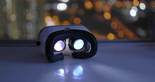 Virtual Reality Headset Glows with Futuristic City Lights