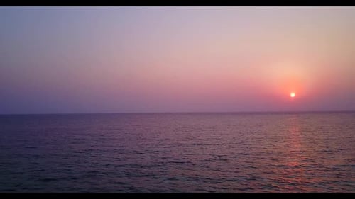 Aerial above scenery of marine island beach lifestyle by blue green sea and white sandy background o