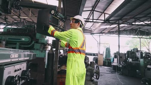 Smart Factory Worker Using Machine in Factory Workshop