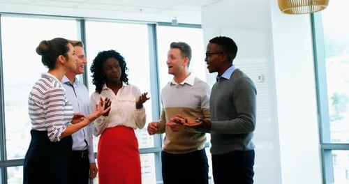 Group of Business People Discuss Ideas in Office