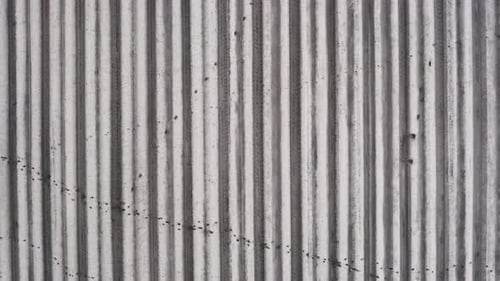 Aerial Shot of Furrows on Raw Plowed Field.