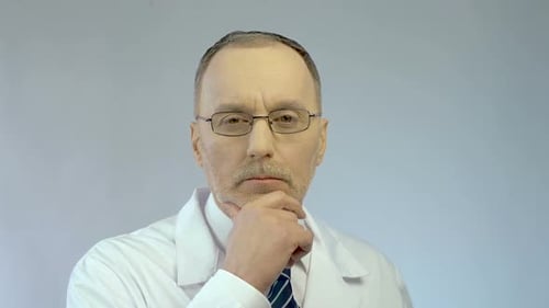 Man Doctor Thinking Wearing a Lab Coat