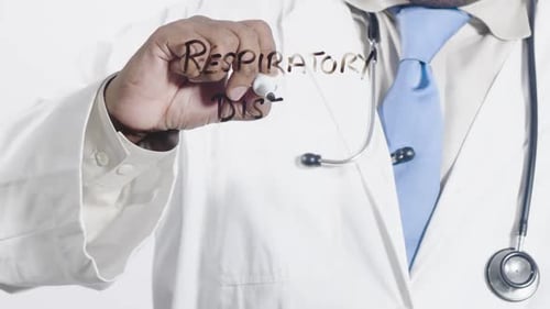 Doctor Writes Respiratory Disease on Clear Surface