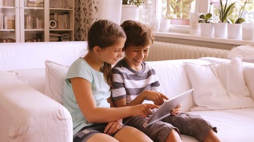 Children using digital tablet