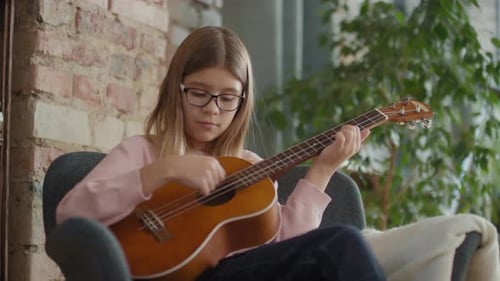 12-Year-Old Girl Playing Ukulele